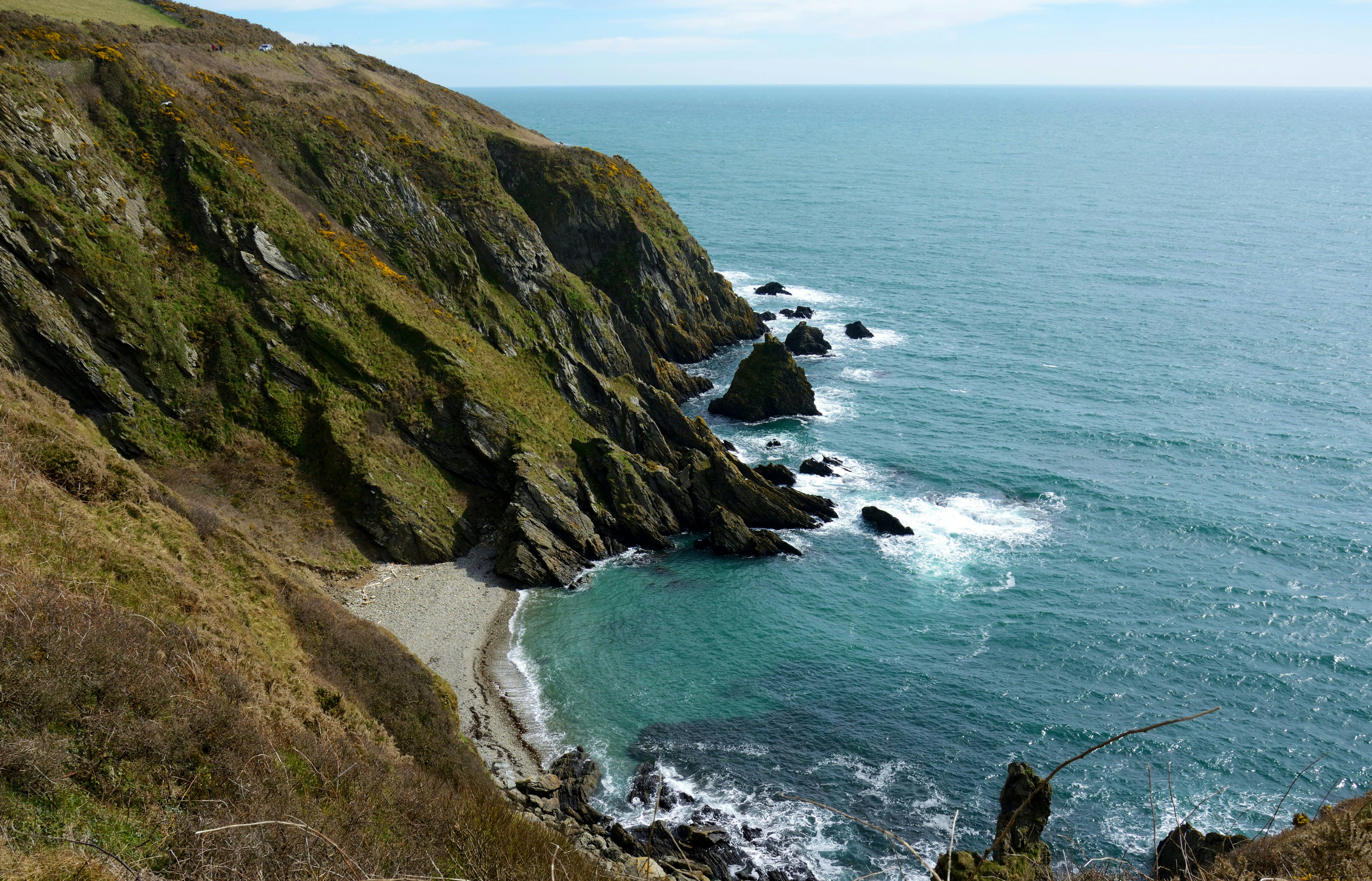 Waves breaking against rocky coastline