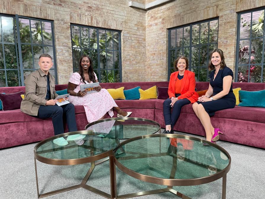 Picture of Professor Michaela higgins and siobhan gaynor on the set of Ireland AM. Siobhan and michaela are seated on a sofa across from two presenters. everyone is smiling.