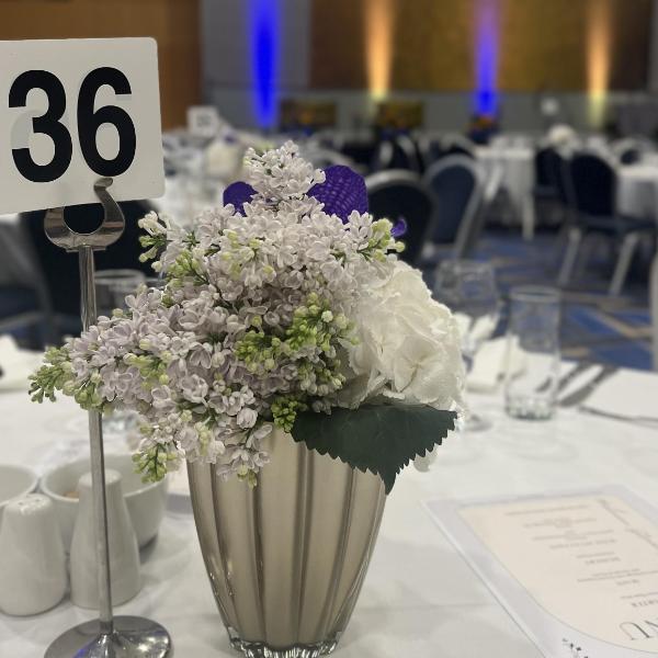 Flowers on a table at a gala dinner