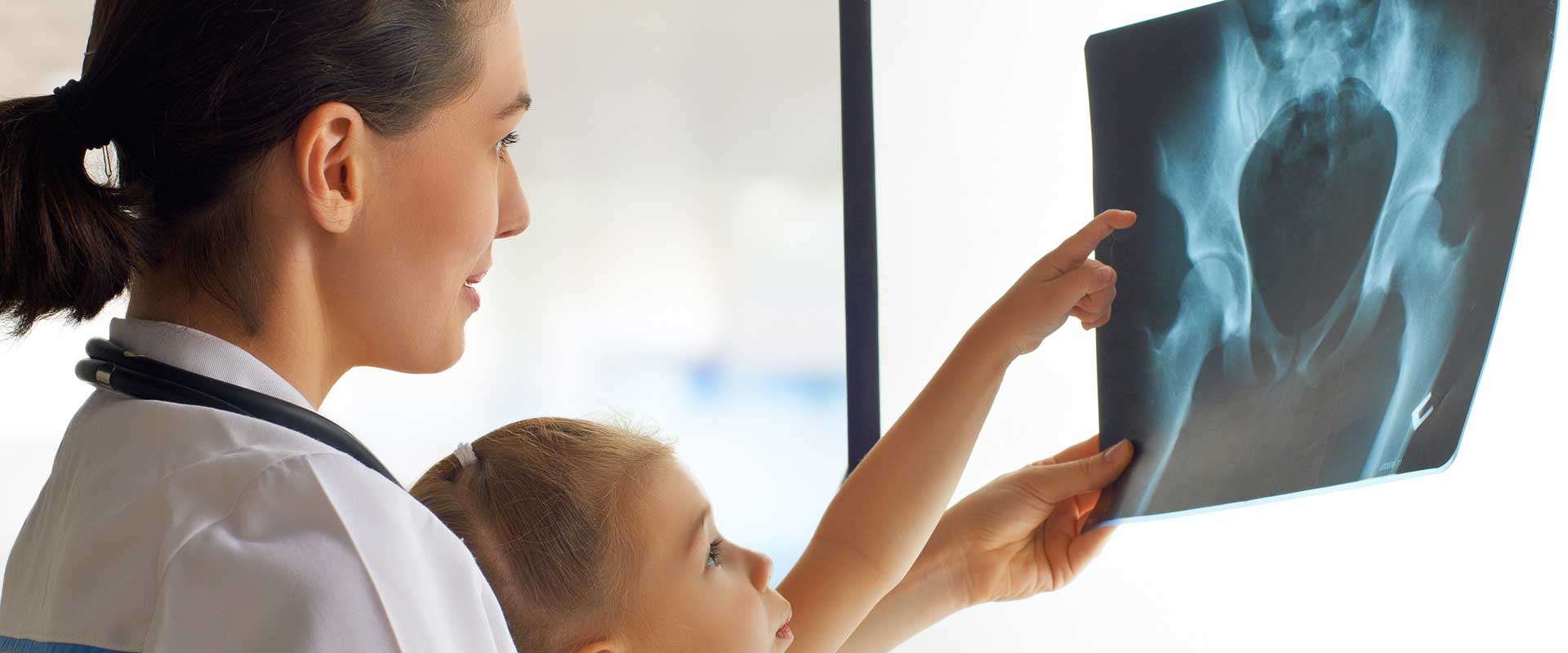 child looking at xray