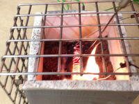 image of burn box with flame inside