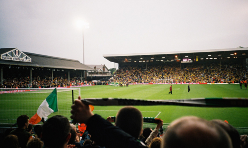 Stadium full of people watching football match