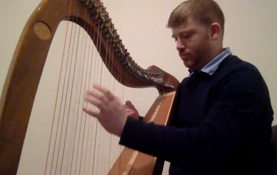 Oisín Morisson playing harp