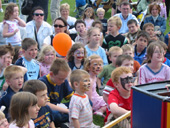 Group of children watching show.