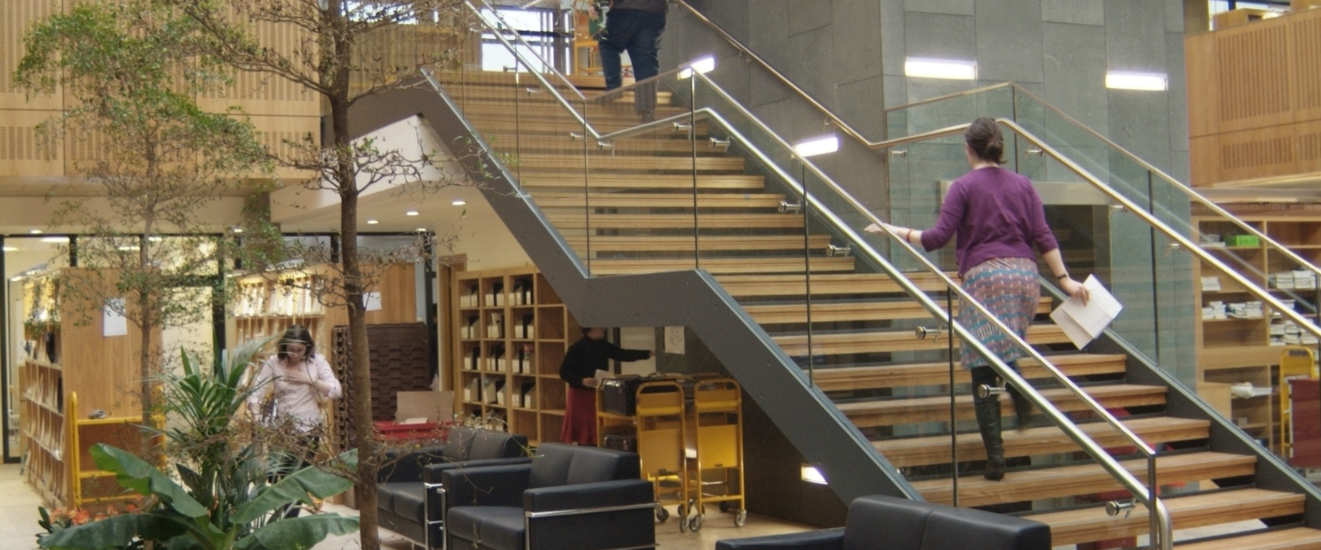 Student walking up stairs in UCD Health Sciences library