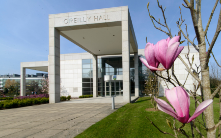 Entrance to OReilly Hall at UCD with pink magnolia in foreground