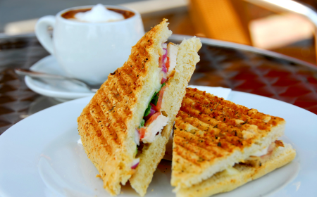 Toasted sandwich with cup of coffee