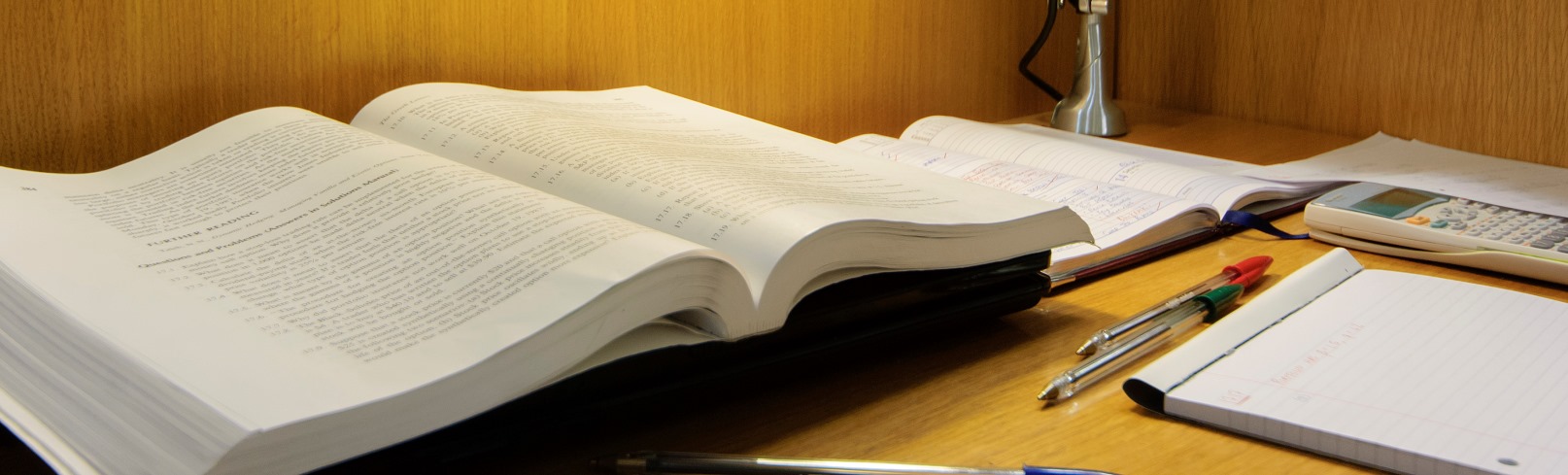 A book open for study in a well-lit room