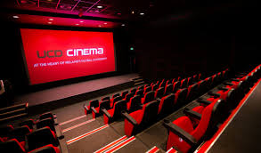 Seats are in rows looking at a large HD Screen of a Cinema theatre