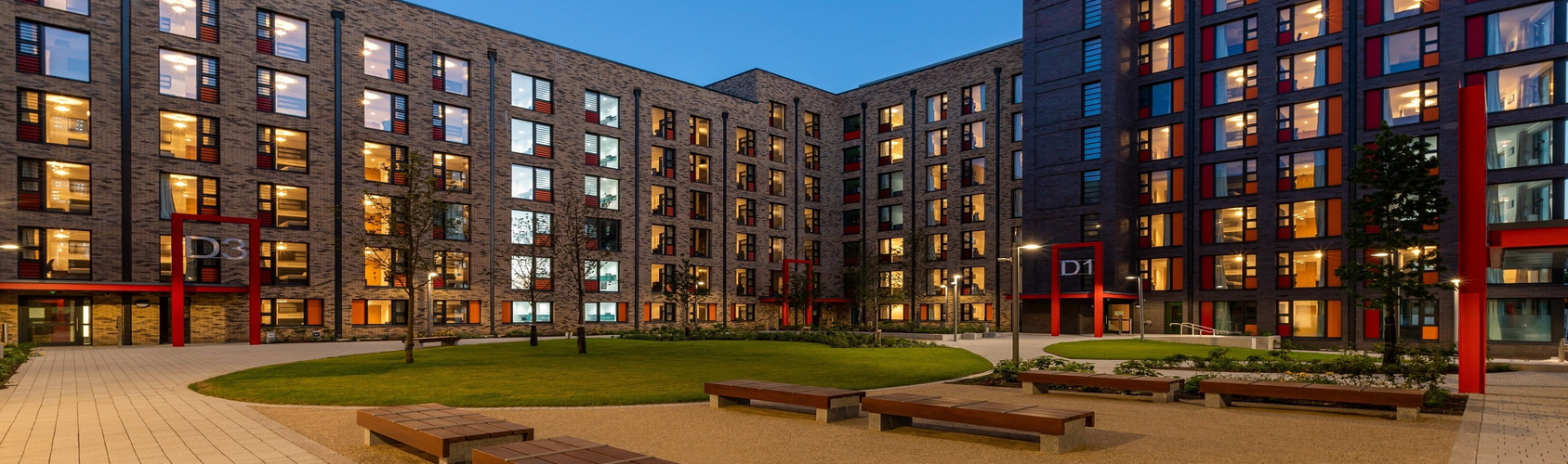 Exterior shot of the UCD Village accommodation with a night sky overhead