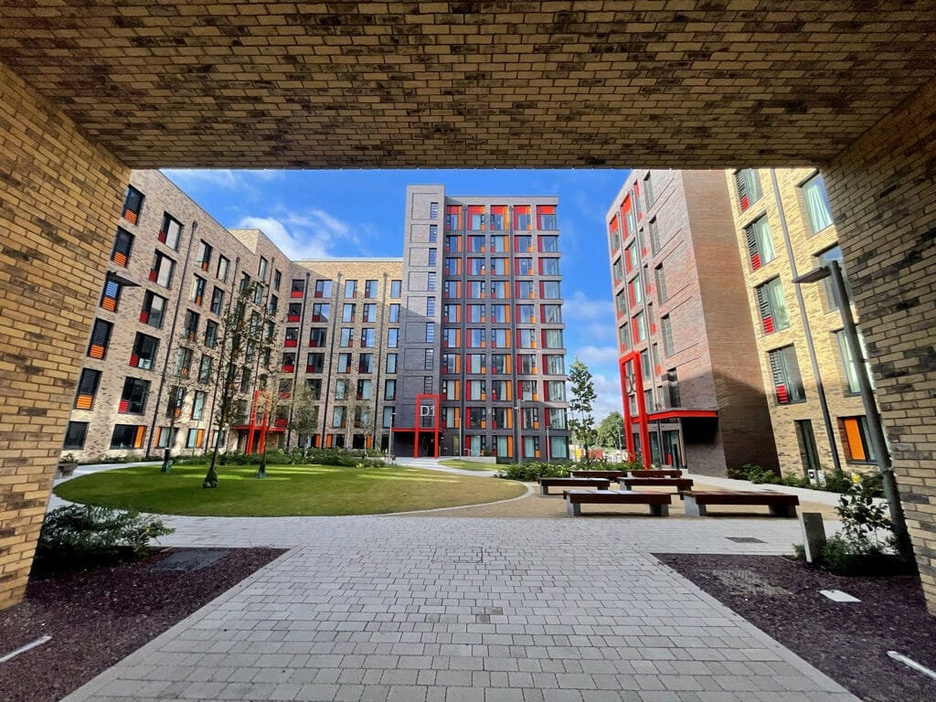Exterior shot of the UCD Village accommodation with a cloudy sky overhead