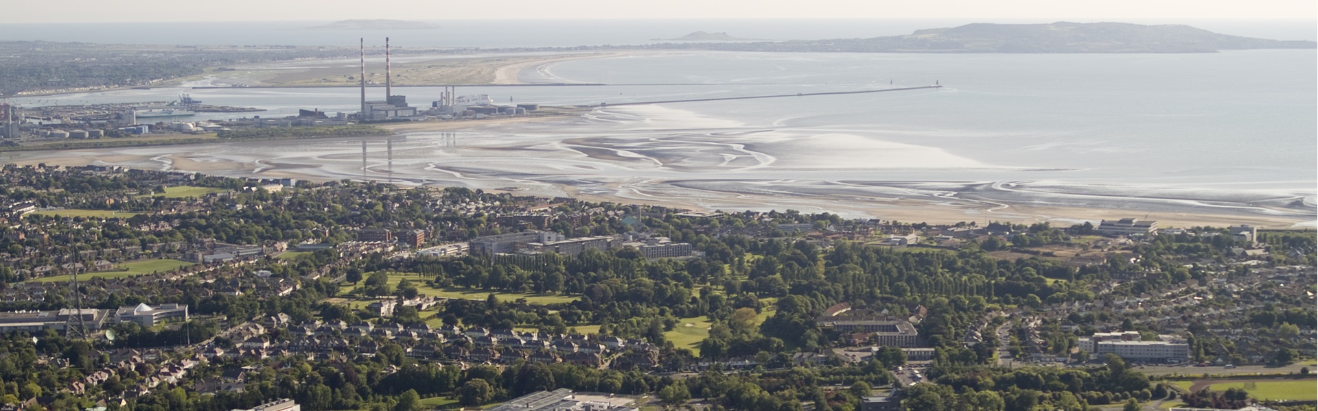 Aerial view of campus down to Dublin Bay including Poolbeg Towers